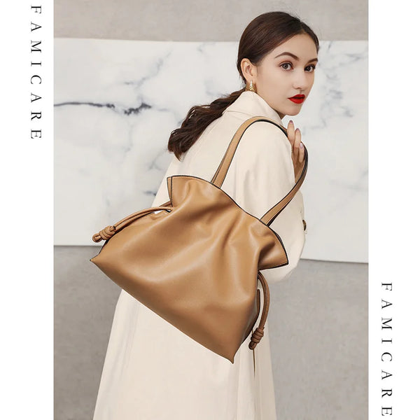 Cowhide Leather Pleated Bucket Bag – Shop at OWNLUXE